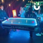 Air Hockey Table at an student event with people playing and having fun