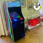 Arcade Machine indoors at a daytime party next to the mega buzz wire