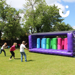 Guests lining up to have a go on the Assault Course Pillars Bish Bash 