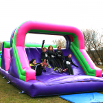A group of women posing on the Assault Course main sectinon