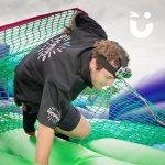 One of our Fun Experts trying out our Assault Course Scramble Net Inflatable Hire