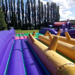 Our Assault Course Balance Run Hire set up for a family fun day in the sunshine 