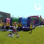 Assault Course Multiple Sections at a team build event with a crowd of children in team bibs ready to go