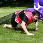 Man under the Assault Course Scramble Net