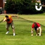 Two men racing out of the Assault Course Scramble Net
