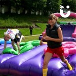 young girl racing through the Assault Course Tyres