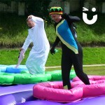 women dressed as cool runnings on the Assault Course Tyres