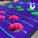Pot Holes Inflatable set up outside of our warehouse