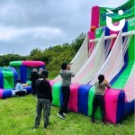 Basketball Inflatable Hire 2 set up outside at a student event with fun day goers enjoying the inflatable