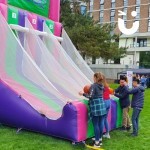 Basketball Inflatable Hire 5 at a university event with 4 students enjoying the inflatable