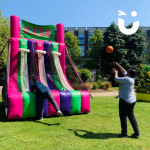 Two people throwing balls at the Basketball Inflatable