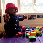 A real life Paddington Bear playing with the Big Rubber Lego Hire
