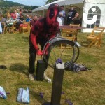 Boom Balloon Blasters Hire2 at an outdoor corporate fun day being used by a man dressed as Deadpool