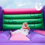 Adult Castle at a wedding with the bride adjusting her veil after some vigorous bouncing