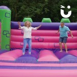 man and women on the bounct castle event hire
