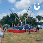 Bungee Trampolines Hire 3 at a family fn day being enjoyed by children