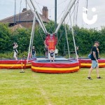 Bungee Trampolines Hire 4 at a family fun day filled with bouncing children