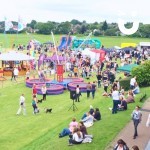 Bungee Trampolines Hire 6 at a colourful family fun day from a high up point of view