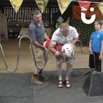 A father and grandfather use their child as the wand in the Human Buzz Wire challenge - a game that see's a person don the Hoop helmet and becomes the wand in this fun challenge