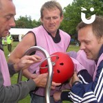 As part of a team building event, a team take on the challenge of the Human Buzz Wire, with one team member becoming the wand!
