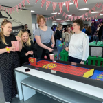 Colleagues playing Carnival Coin Roller Hire