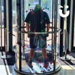 Ballnado Grabber 3 hire set up in a foyer with a man facing away mentally preparing to catch some balls