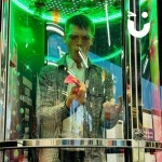 Cash Grabber Hire 10 set up at an exhibition with a man inside looking very please that he's caught some cash