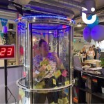 Cash Grabber Hire 11 at a corporate exhibition with a woman inside grabber that cash