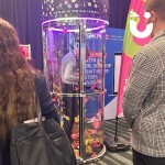 Cash Grabber Hire 12 set up at an exhibition with the fun expert branding and onlookers