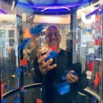 Cash Grabber Hire 13 at a corporate event with a man catching company coloured tickets to win a prize