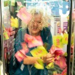 Cash Grabber Hire 6 at an exhibition with a woman laughing inside the grabber