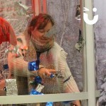 A lady inside of our Cash Grabber Hire with festive branding