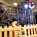 Our Christmas Cash Grabber Hire infront of a snowman for to add extra Christmas atmosphere