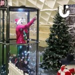 Christmas Cash Grabber Img Hire set up on an indoor football pitch with a footballer catching funny money
