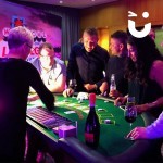 Guests watch on as the dealer reveals their next hand