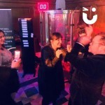 Cash Grabber Hire at a corporate evening event with happy people around it