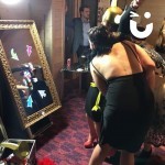 Magic Selfie Mirror at a corporate evening event with a crop of glamorous women having their photo taken