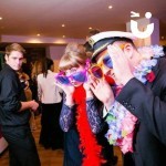 Magic Selfie Mirror being used my a man and woman dressed up in fun props