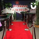 Red Carpet with Las Vegas Backdrop and casino tables