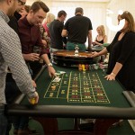 Guests setting their bets for the Roulette Casino Table Hire