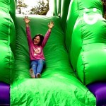 Young girl sliding down our children's slide