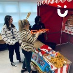 Christmas Funfair Target Stall being used in an office party by 2 fun-seekers trying to win a novelty prize