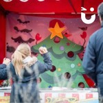 Christmas Funfair Target Tree stall being used by a young girl at an outdoor company Christmas party