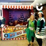 Christmas Funfair Hoopla STall set up and ready to enjoy with 2 adults dressed as elves ready to staff it