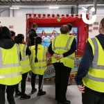 Festive Hook A Duck at a corporate event surrounded by a crowd of colleagues wearing hi-vis jackets awaiting a turn