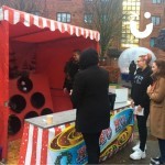 Christmas Ball In A Bucket Stall at a university event with students having a go at winning a prize