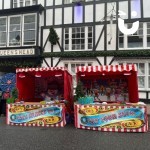 Christmas Snowball Toss Hire set up in the hight street next to another stall ready to be enjoyed