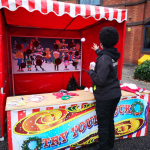 Fun Expert throwing snowballs at our Snowball Toss Side Stall