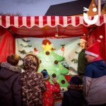 Christmas Target Tree Side Stall at an evening festive event being enjoyed by children