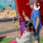 Circus Skills Workshop Hire with 2 young children plate spinning at a corporate fun day